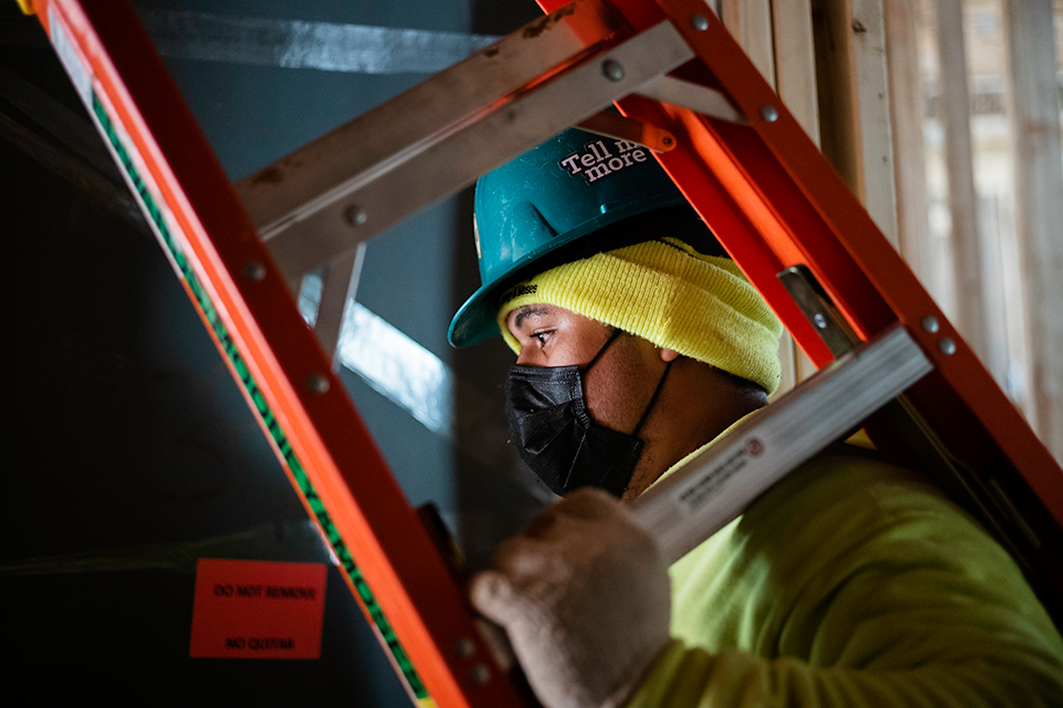 A technician with a ladder